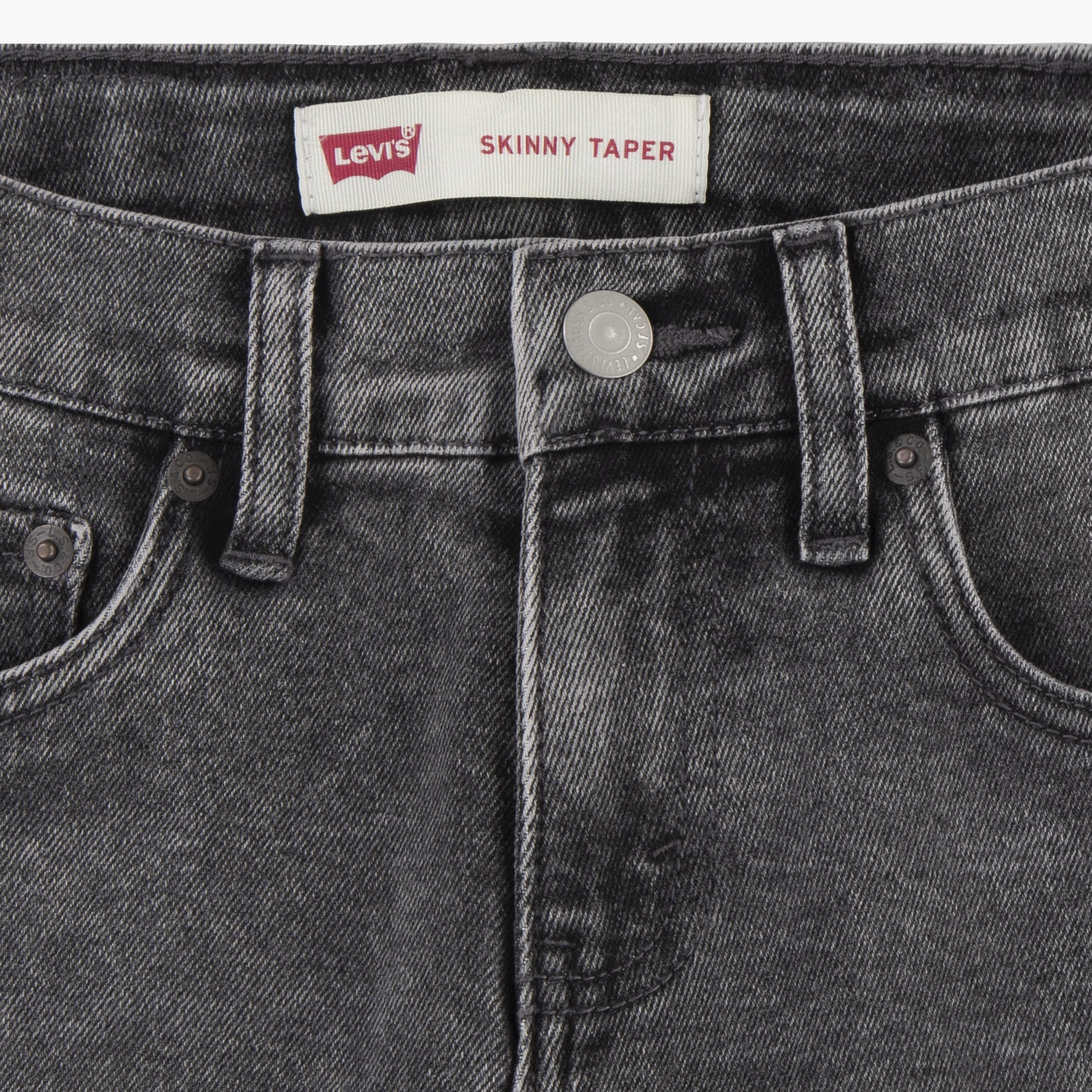 The perfect addition to your toddler boy's casual wardrobe. Designed with meticulous attention to detail, these jeans offer a sleek and stylish look. The button closures not only add a touch of sophistication but also ensure a secure fit. Made with utmost comfort in mind, these jeans are gentle on your little one's delicate skin. The adjustable waist feature allows for a customized fit, ensuring maximum comfort throughout the day. Upgrade your toddler's style game with these trendy and comfortable jeans that are sure to make a statement.-boys-clothing-bottoms-jeans-image-3