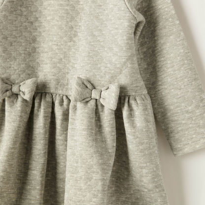 Juniors Textured A-Line Knit Dress with Long Sleeves and Bow Applique