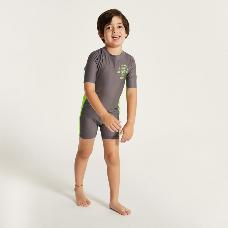Juniors Printed Swimsuit with Short Sleeves and Zip Closure