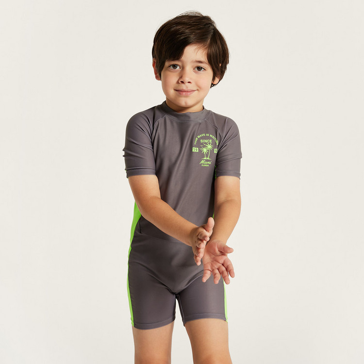 Juniors Printed Swimsuit with Short Sleeves and Zip Closure