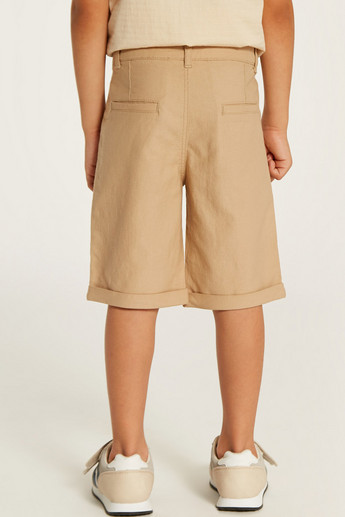 Juniors Solid Mid-Rise Shorts with Pockets and Button Closure