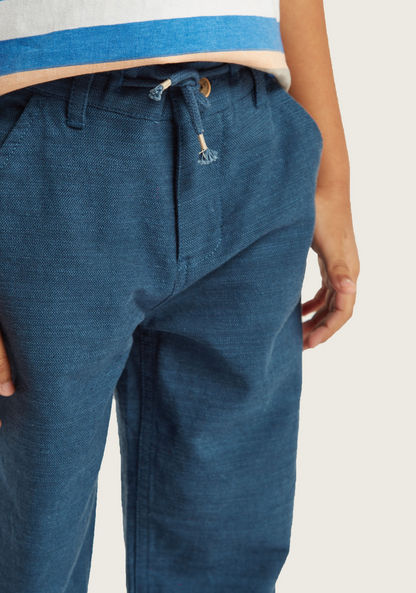 Solid Woven Pants with Pocket Detail and Button Closure