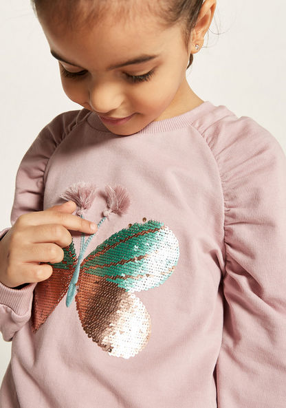 Juniors Embellished Butterfly Sweater with Long Sleeves and Ruched Detail