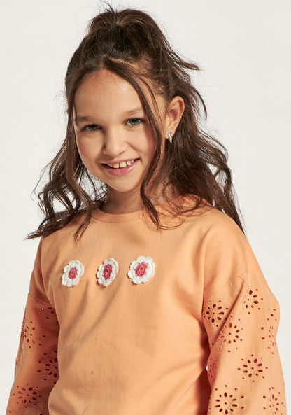 Juniors Schiffli Detail Pullover with Floral Accents and Long Sleeves