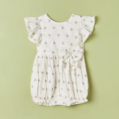 Giggles All-Over Embroidered Romper with Bow Accent and Button Closure