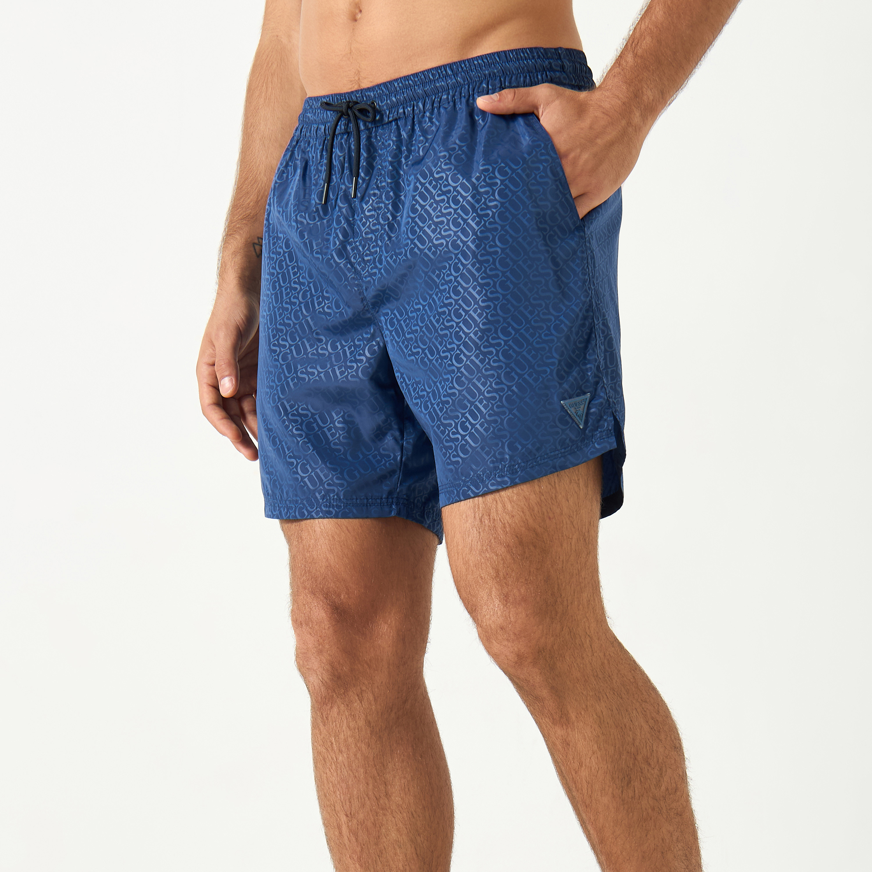 Guess All-Over Logo Print Swim Shorts with Drawstring Closure and Pockets-men-clothing-swimandbeach-shorts-image-1