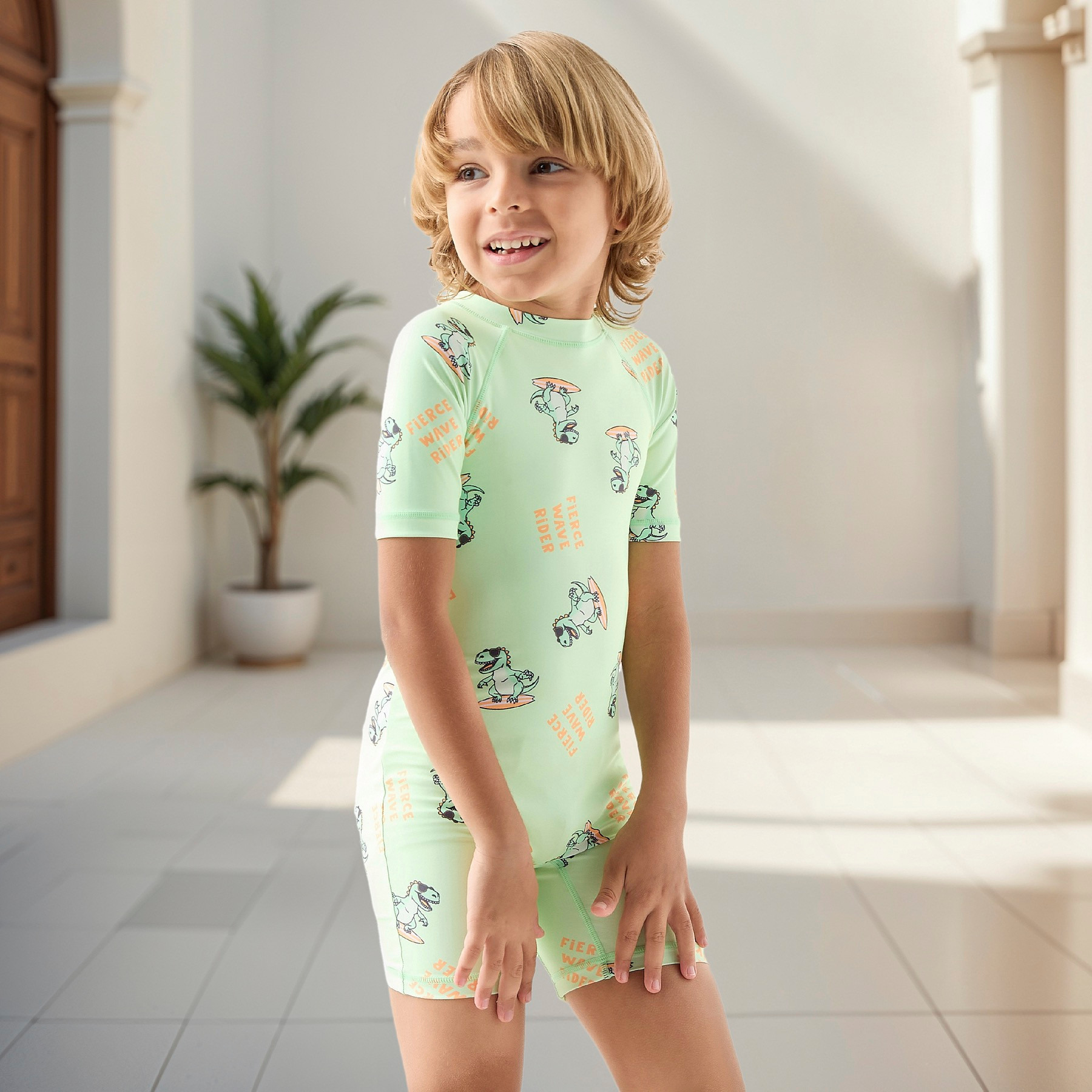 Juniors All-Over Dinosaur Print Swimsuit with Raglan Sleeves-sports-gear-swimming-boy-image-1