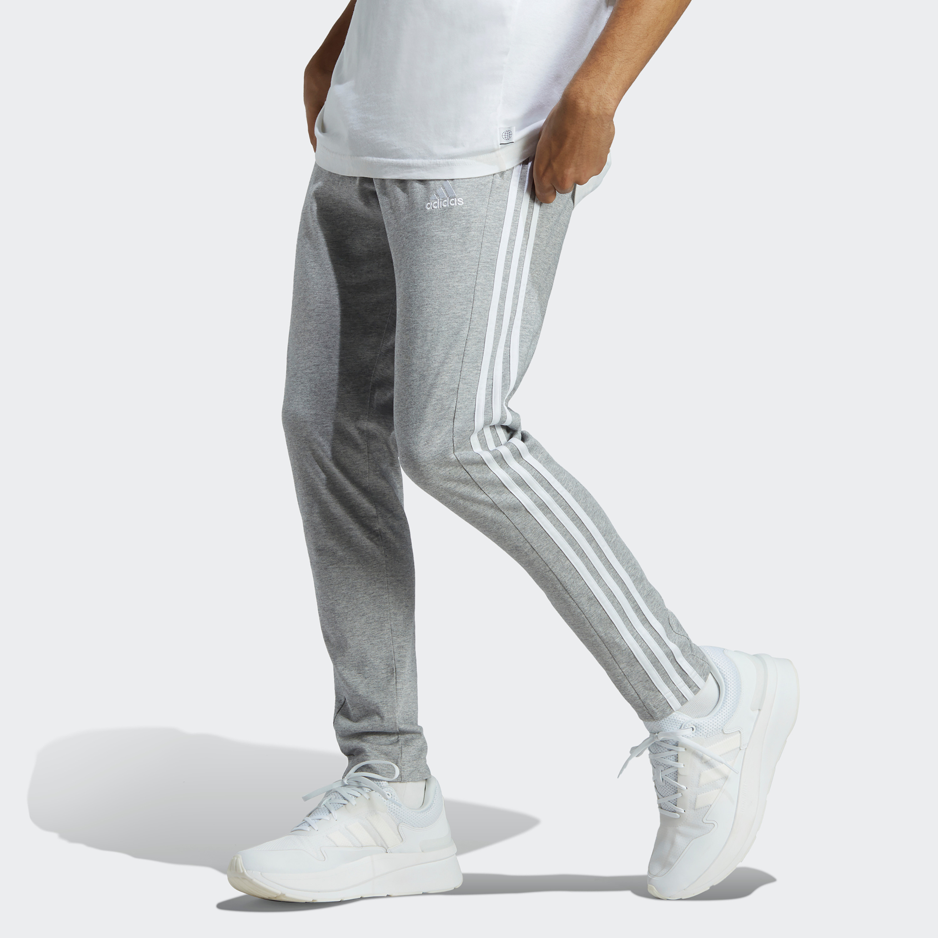 Buy Men s Adidas Men Essentials Single Jersey Tapered Open Hem 3 Stripes Joggers OE Online Centrepoint KSA