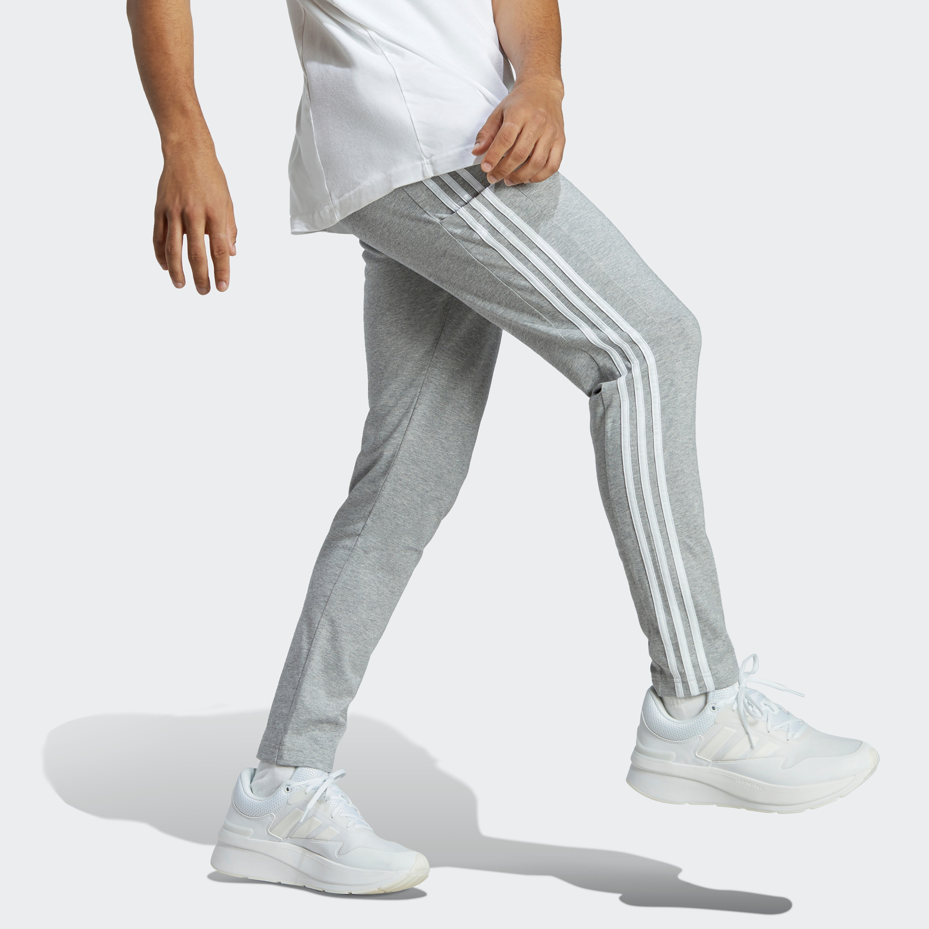 سروال اسنشالز للرجال بحاشية مفتوحة وتصميم خطوط اديداس الثلاثة| او اي-men-clothing-sportswearandactivewear-bottoms-image-10