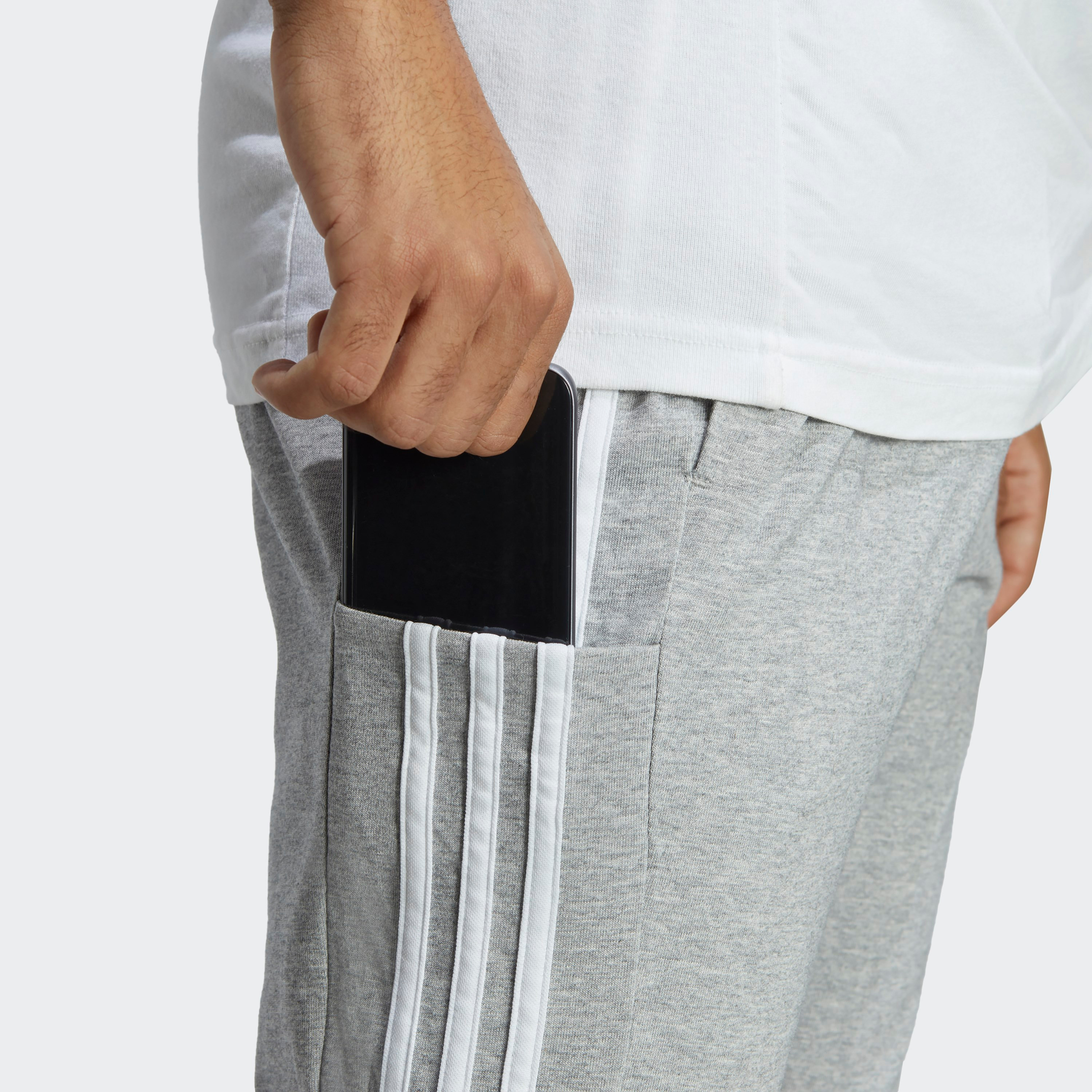 سروال اسنشالز للرجال بحاشية مفتوحة وتصميم خطوط اديداس الثلاثة| او اي-men-clothing-sportswearandactivewear-bottoms-image-11