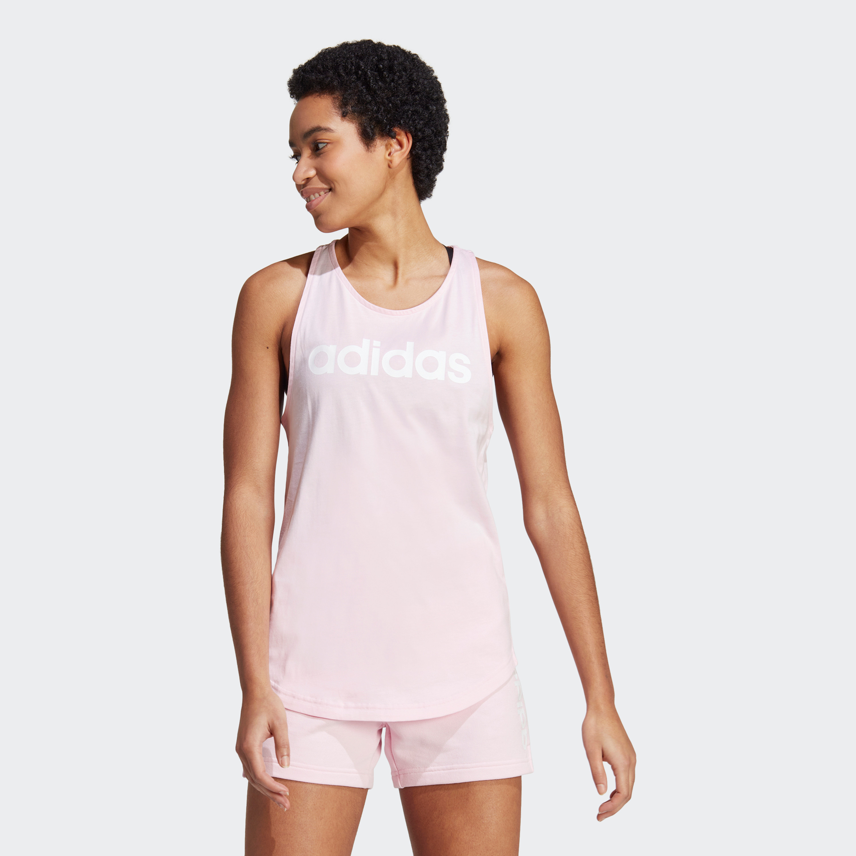 تانك توب بشعار اسنشيالز فضفاض من اديداس| او اي-sports-women-clothing-tshirtsandvests-image-1