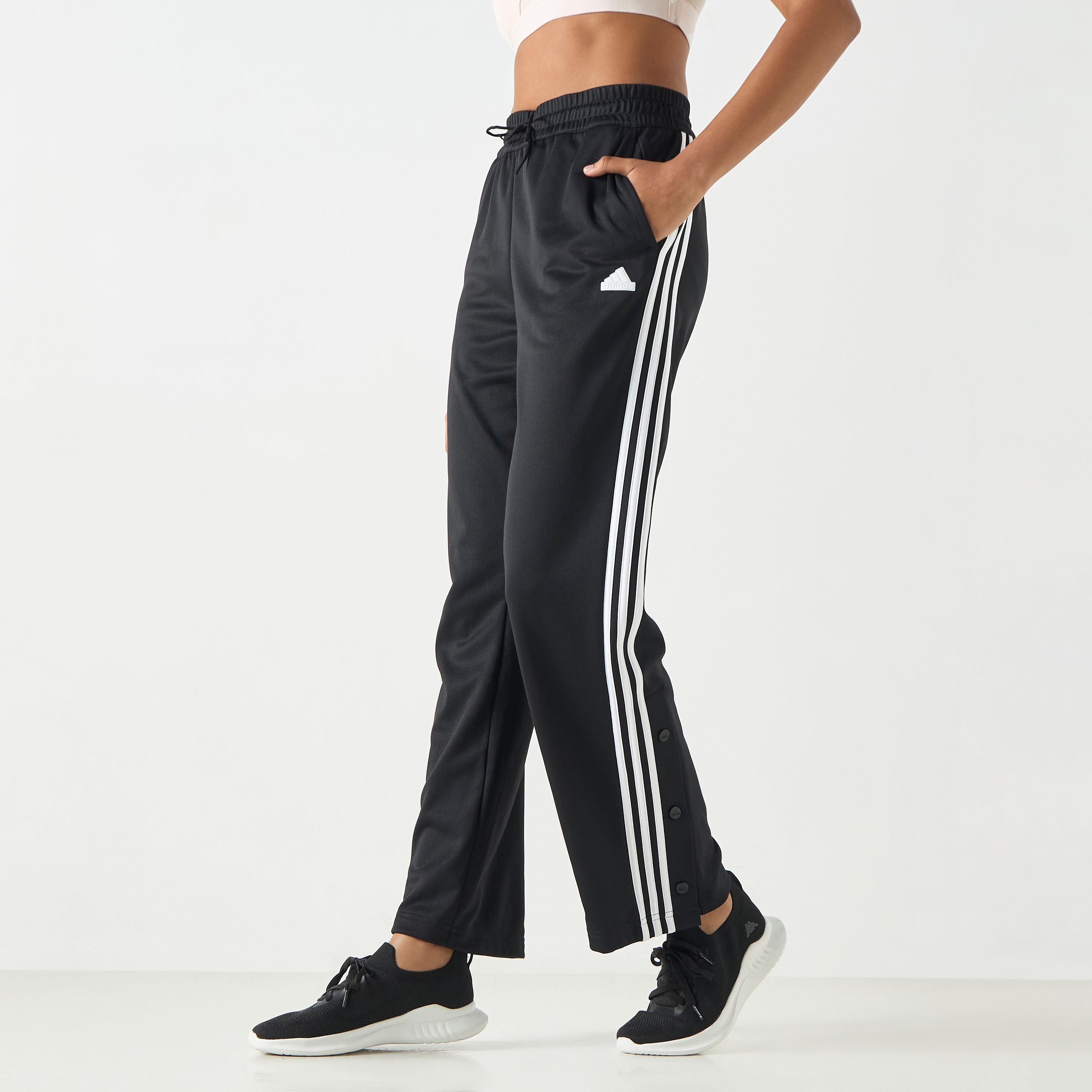 أديداس - بنطال آيكونيك بثلاثة خطوط وكباسات IN1833-women-clothing-bottoms-joggers-image-1
