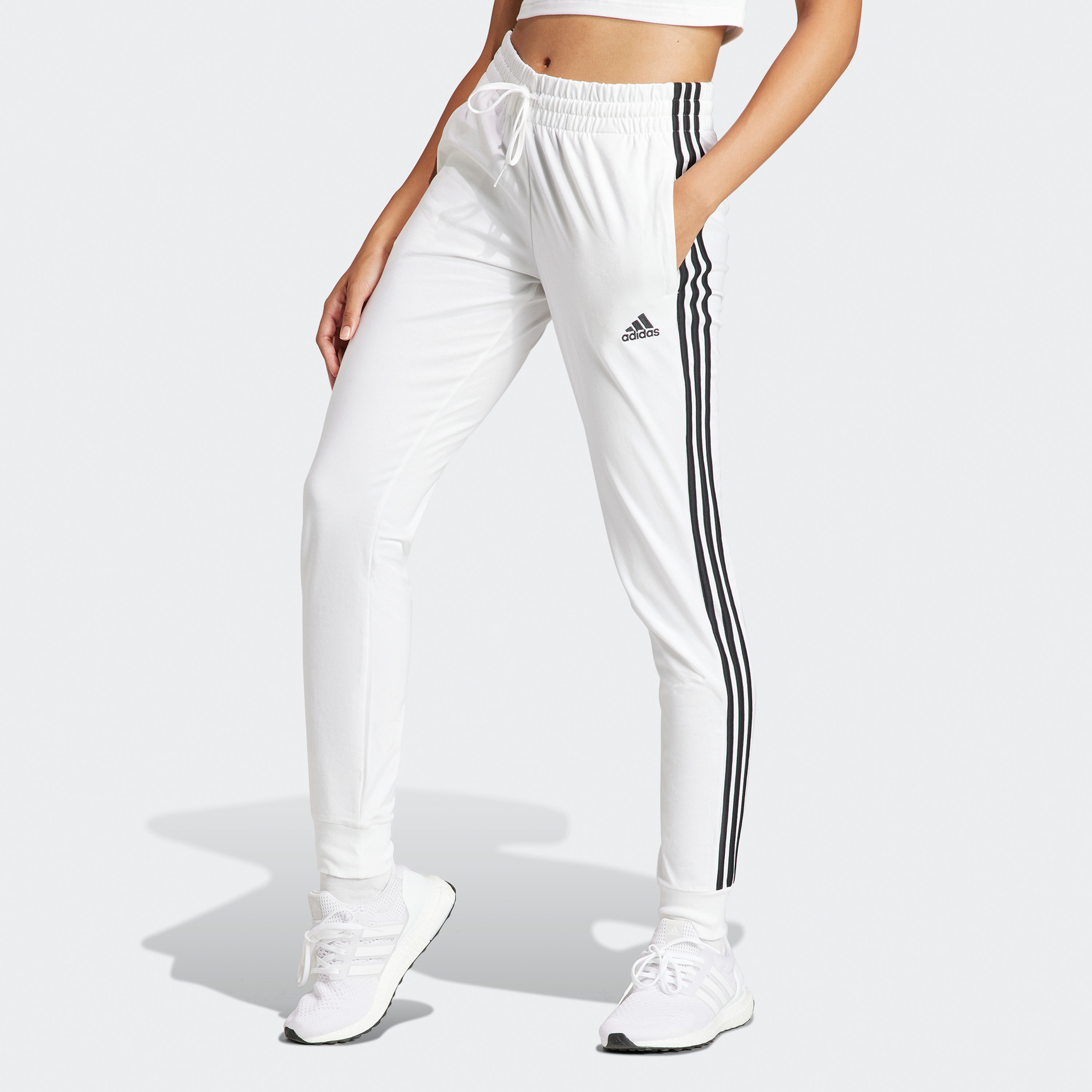 أديداس - بنطال رياضي جيرسي ايسنشالز بثلاثة خطوط IN2253-women-clothing-bottoms-joggers-image-1