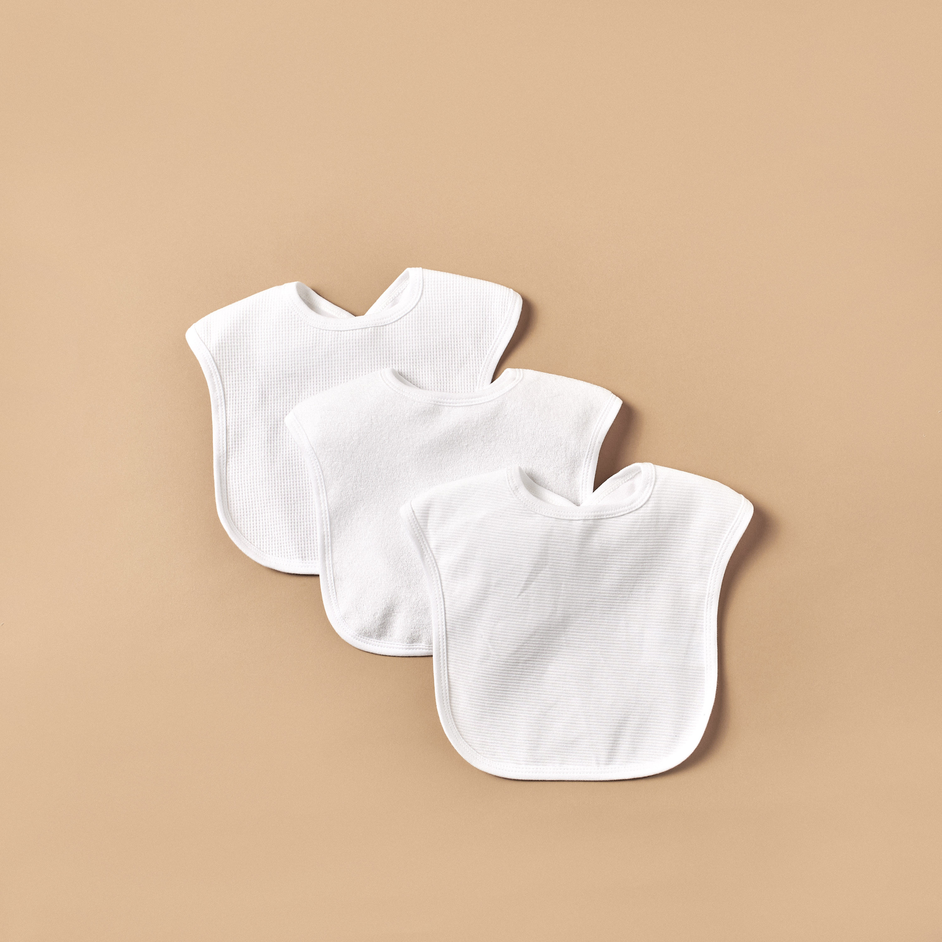 مريلة مدعّمة بزر كباس للإغلاق من جونيورز-baby-feeding-bibs-image-1