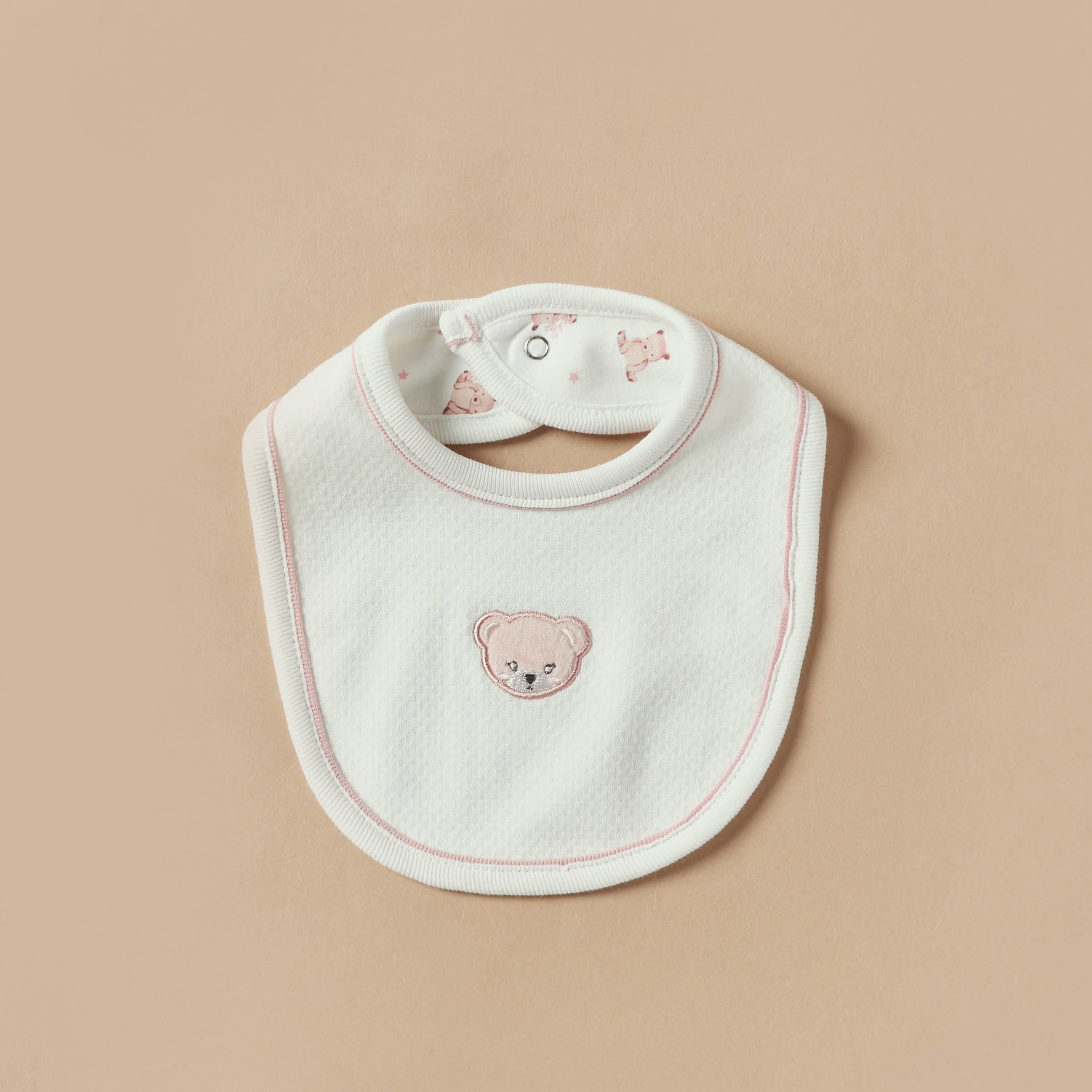 Bibs with store button closure