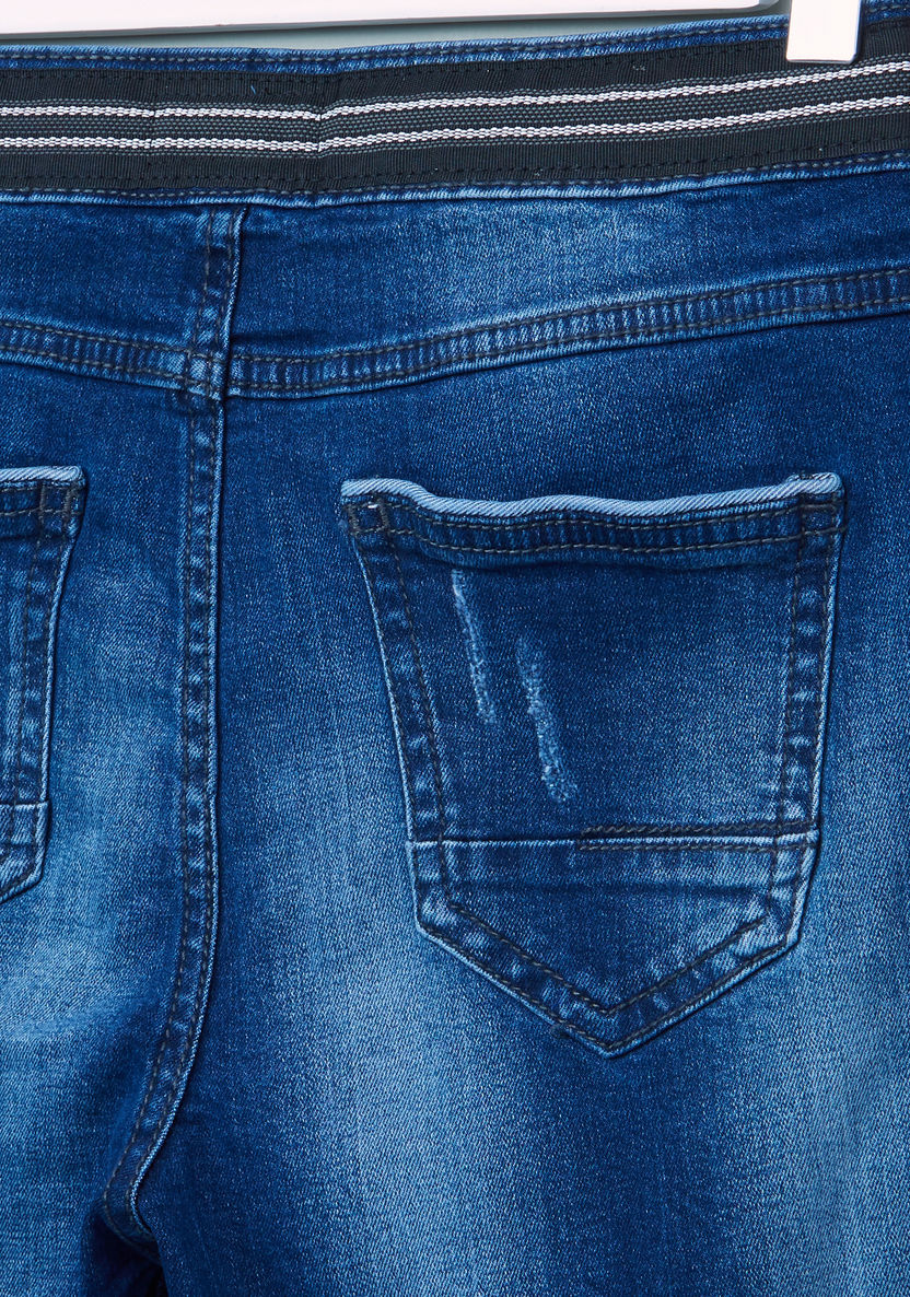 بنطال جينز بجيوب وحافة مطاطية ورباط من بوش.-%D8%AC%D9%8A%D9%86%D8%B2-image-3